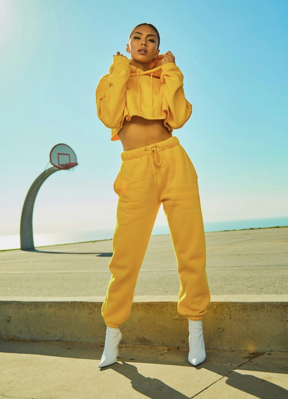 Shopper in a bright yellow outfit